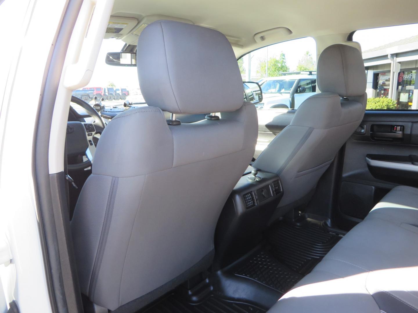 2020 White /GREY Toyota Tundra SR5 (5TFDY5F19LX) with an 5.7L engine, automatic transmission, located at 2630 Grass Valley Highway, Auburn, CA, 95603, (530) 508-5100, 38.937893, -121.095482 - Features - King Off Road adjustable remote reservoir coil overs, King 2.5 adjustable remote reservoir rear shocks, Method Race wheels, Falken Wildpeak tires, Sliders, Bed braces, Borla Exhaust, Husky floor mats, Window tint, and Ram phone mounts. - Photo#38